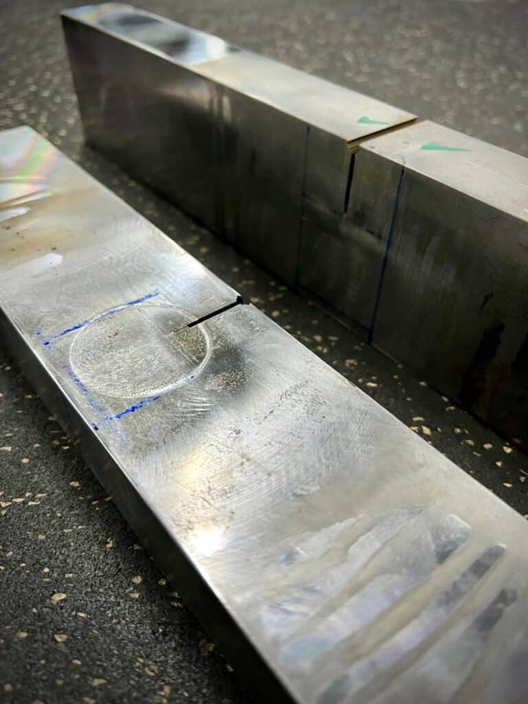 Machined SENB specimens with fatigue pre-crack notch prepared for CTOD fracture toughness testing.