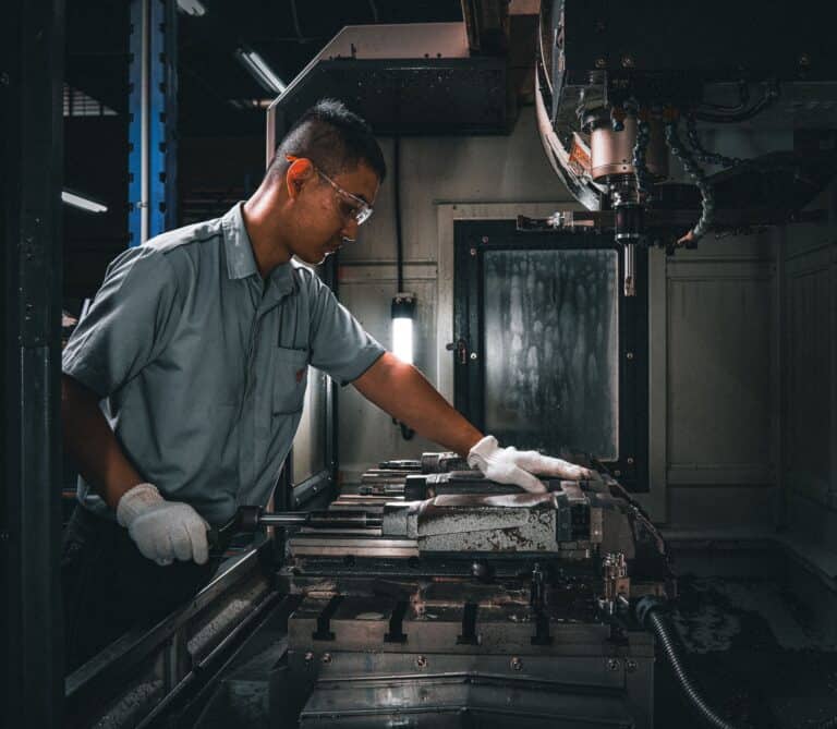 An engineer prepares specimens for a crack tip opening displacement test, essential for offshore structures.